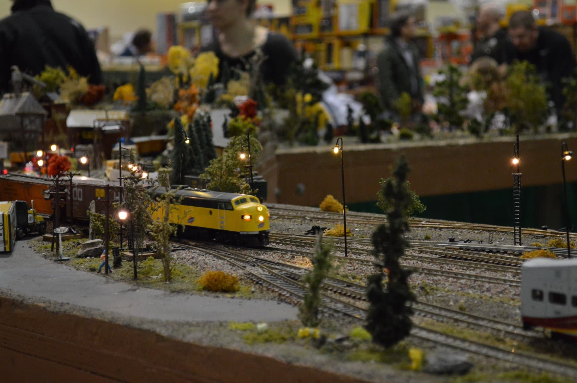 Yellow diesel locomotive on a detailed layout